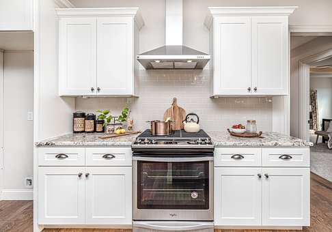 white cabinets with an oven and stove in the center