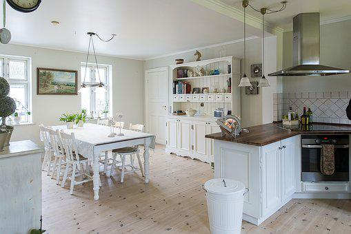 a kitchen space with a dining table